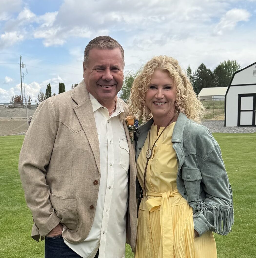 Smiling married couple standing together, offering hope when your spouse refuses counseling